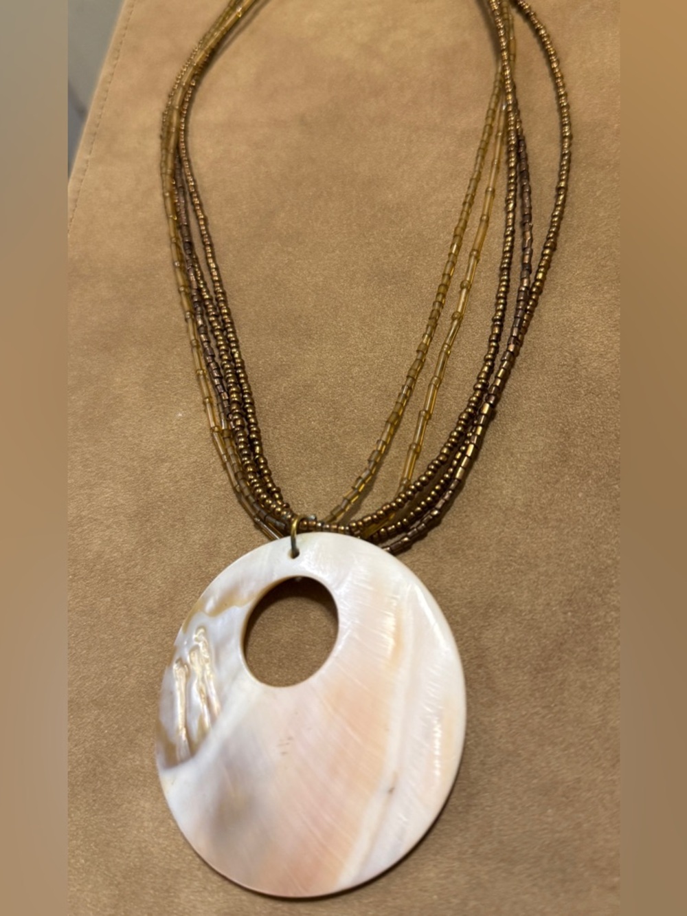 Multi-Strand Beaded Necklace with White Shell Pendant